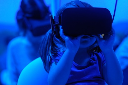 A Child Wearing a VR helmet
